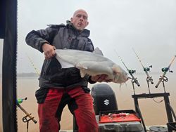 A man fishing for a big blue catfish in North Carolina