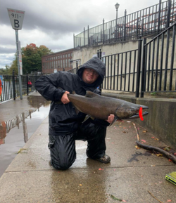 A person fishing with a rod in New York