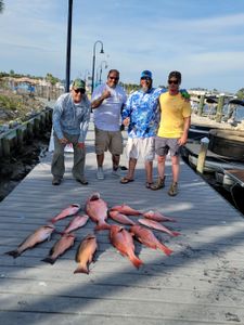 4 people fishing in Florida with 5 fish
