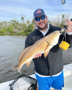 Angler with one fish caught at Fort Myers Beach