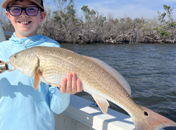 Angler with a 22-inch fish at Fort Myers Beach