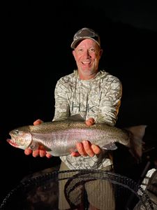 Angler with rainbow trout in Branson