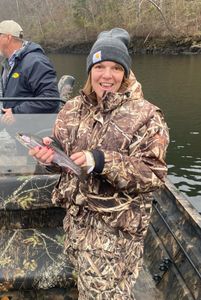 Angler with a rainbow trout caught in Branson
