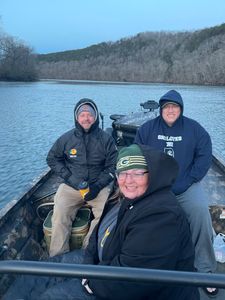 Three people enjoying a fishing trip in Branson