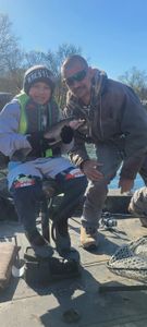 Two people fishing in Branson