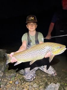 Angler holding a 26-inch fish in Branson