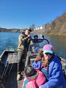 Three people enjoying a fishing trip in Branson
