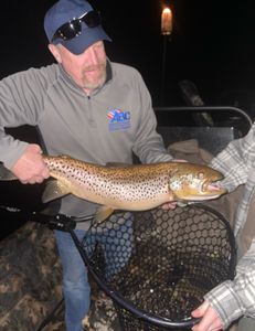 Angler with a large sea trout caught while fishing in MO