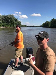 Two people fishing in Branson