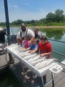 A group of 5 people fishing in OK