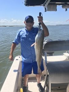 Angler holding a 27-inch fish at the Port Orange Gateway Center