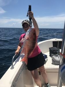 A person fishing at the Port Orange Gateway Center