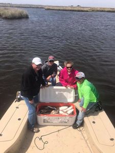Four people fishing at Golden Meadow