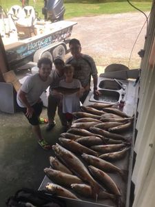 A group of 4 people fishing in LA