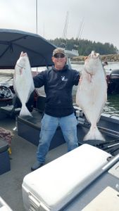 Two large Pacific Halibut caught fishing in Charleston OR displayed on boat deck