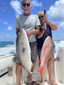 Two anglers holding big fish in Marathon, Florida