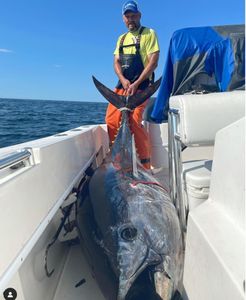 A lone angler reeling in a big catch in Carteret