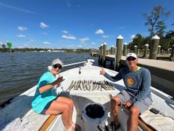 Successful fishing trip in Gulf Shores AL with impressive catch displayed on boat deck