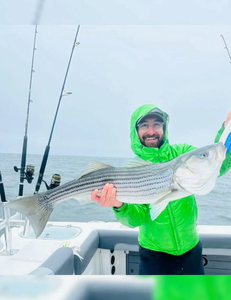 Caught a whopping striped bass out on the water!