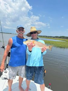 Anglers reeling in a great catch on a fishing tour in FL