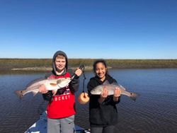 Two black drum fish caught during a fishing tour in FL