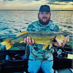 Angler holding a 27-inch fish in Saskatchewan