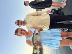 Two people fishing in Lago Vista