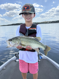 Nice largemouth bass caught with fly fishing and light tackle under partly cloudy skies!