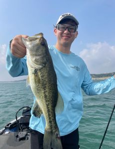 Lone fisherman casting line in Lago Vista