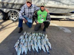 Two people enjoying a fishing adventure in TX