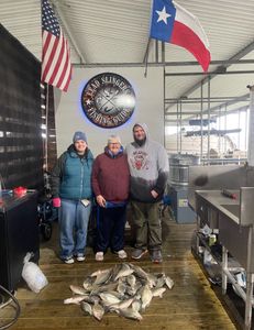 Three anglers enjoying a fishing trip in TX