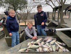 Three people enjoying a fishing, hunting, or tour experience in TX