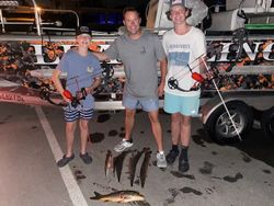 A group of 5 people enjoying a fishing trip in Forney