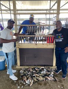 Three people enjoying fishing, hunting, or tours in TX