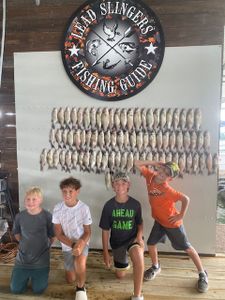 Four friends enjoying a fishing adventure in TX