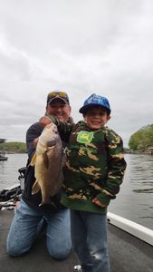A photo of two people fishing in Osage Beach