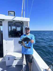 Two anglers enjoying a fishing trip in Neptune City