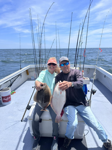 Two summer flounder, each measuring 22 inches, caught while fishing in New Jersey