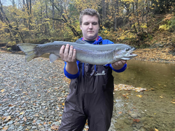 An angler holding a rainbow trout caught in West Springfield