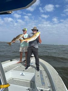 Two anglers with their catch of big fish in Theriot