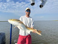 Single fisherman catching a fish in Theriot