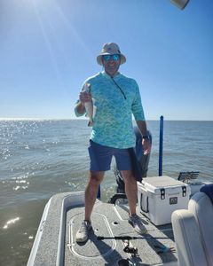 A person fishing with a rod in Theriot