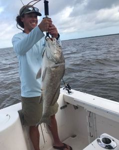 Angler with a black drum fish caught in Apalachicola