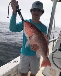 A fisherman with a 19-inch catch in FL