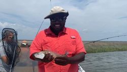 Two people fishing in Apalachicola with one 19-inch fish