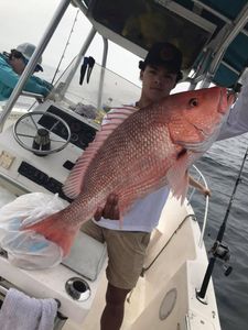 A person fishing on the water in FL