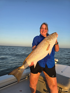 Angler catching a 35-inch fish at Point Comfort