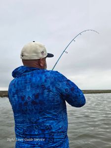 Fishing rod bent with fish on the line at Point Comfort TX
