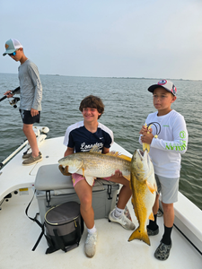 2 fishing anglers with big 38-inch fish in TX