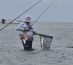 Angler fishing on the shore at Point Comfort